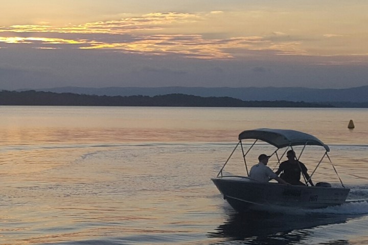 a small boat in a body of water