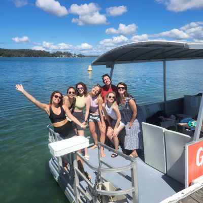 a group of people in a boat on a body of water