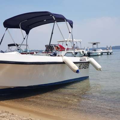 a small boat in a large body of water