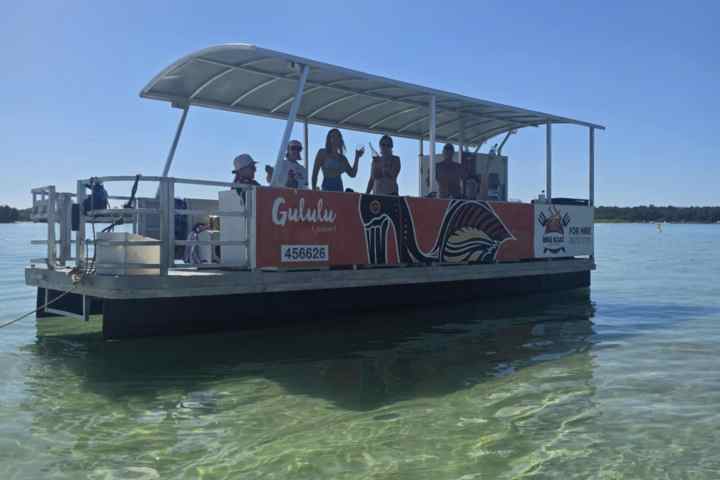a boat is docked next to a body of water