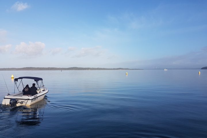 a small boat in a body of water