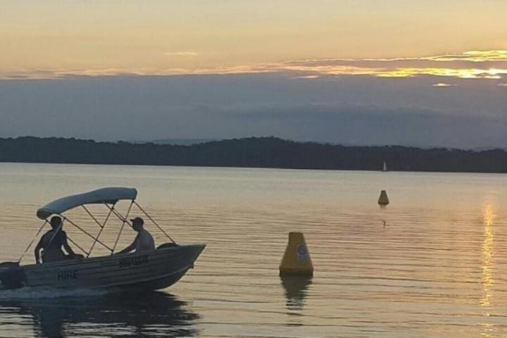 a small boat in a body of water