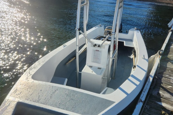 a small boat in a body of water